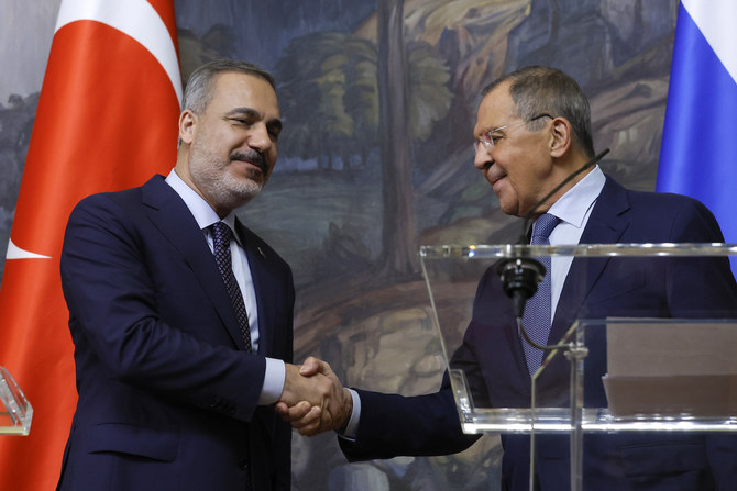 Russian FM Sergey Lavrov shakes hands with Turkish FM Hakan Fidan during a press conference in Moscow, Russia, on Aug. 31, 2023.
