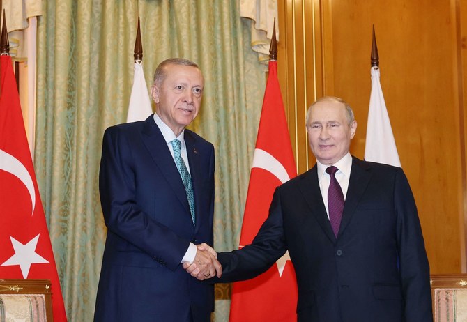 Russian President Vladimir Putin shakes hand with Turkish President Recep Tayyip Erdogan during their meeting in Sochi. (AFP)