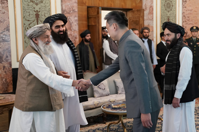 Newly appointed Chinese ambassador to Afghanistan Zhao Xing greets the Taliban’s PM Mullah Hassan Akhund in Kabul.