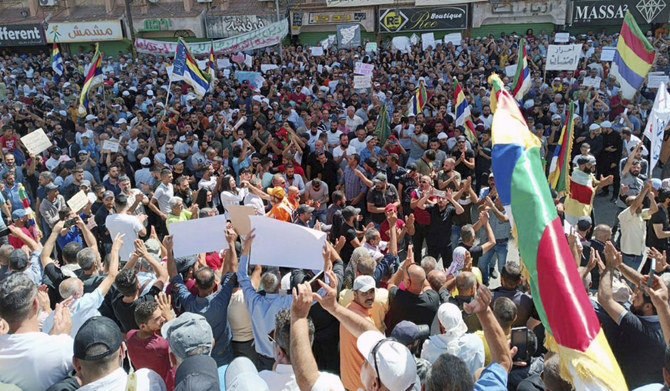 People stage a protest in the southern Syrian city of Sweida on Friday. (AP)