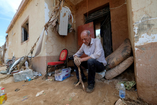 Hassan Kassar sits outside his damaged house, in Derna, Libya September 17, 2023. (Reuters)