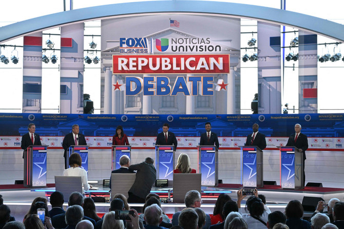 Candidates in 2nd GOP debate attack each other and absentee Trump, who pokes fun at them in a separate event