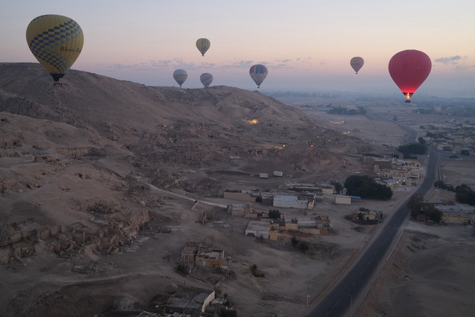 Balloons carrying tourists take off above the west bank of the Nile river in Egypt’s southern city of Luxor. (File/AFP)
