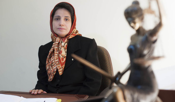 In this Nov. 1, 2008 photo, Iranian human rights lawyer Nasrin Sotoudeh, poses for a photograph in her office in Tehran, Iran.