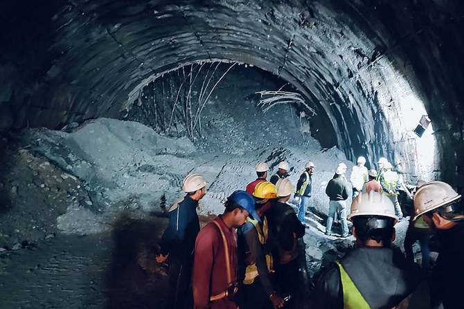 Indian rescuers battle to save 40 workers trapped in collapsed tunnel