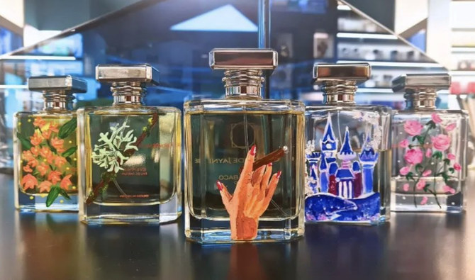 Artist shows off colorful artwork by painting on luxury perfume bottles