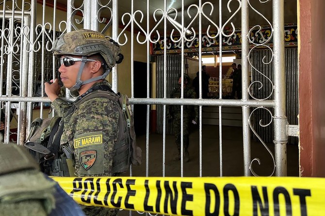 A suspected bomb blast kills at least 4 Christian worshippers during Mass in southern Philippines