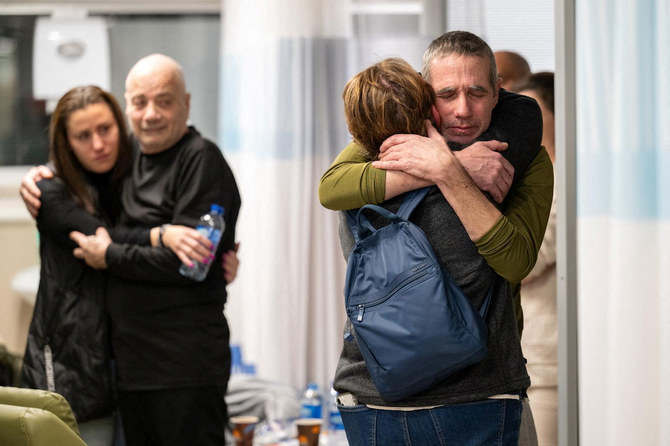 Fernando Simon Marman and Louis Hare reunite with loved ones at the Sheba Medical Center, in Ramat Gan, Israel.