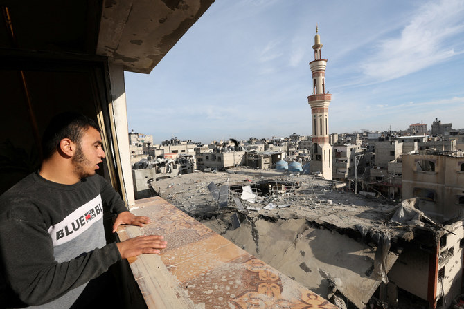 A Palestinian man looks at the site of an Israeli strike on a mosque in Rafah in the southern Gaza Strip, February 12, 2024. 