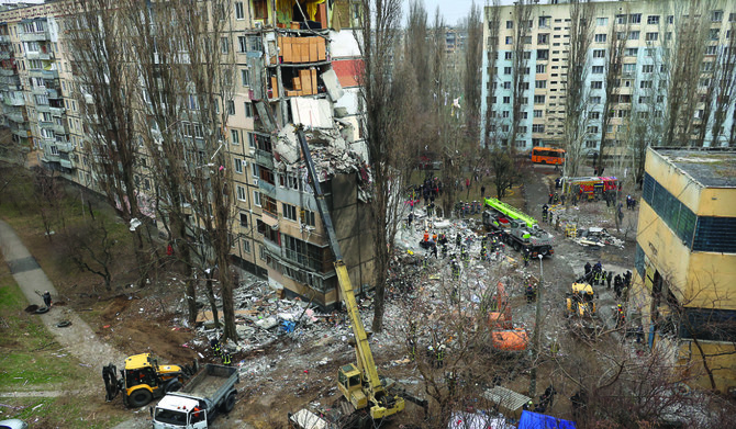 Rescuers work at a site of an apartment building heavily damaged by a drone strike, amid Russia’s attack on Ukraine, in Odesa. 