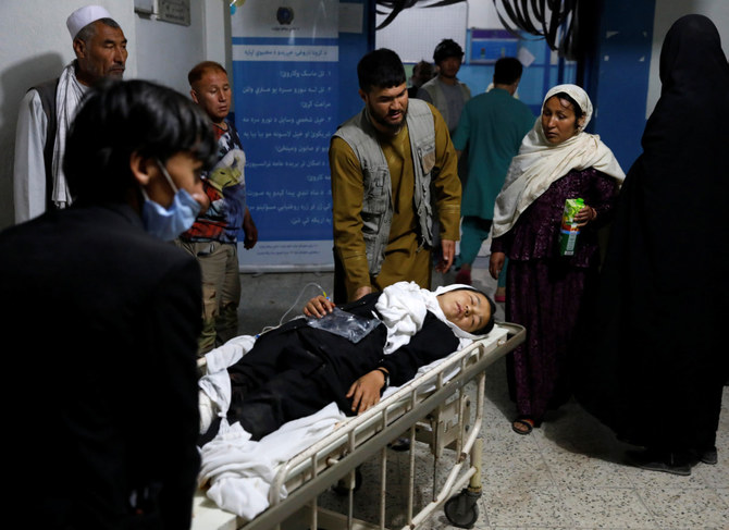 An injured school girl is transported to a hospital after a blast in Kabul, Afghanistan, on May 8, 2021. (REUTERS/Stringer)
