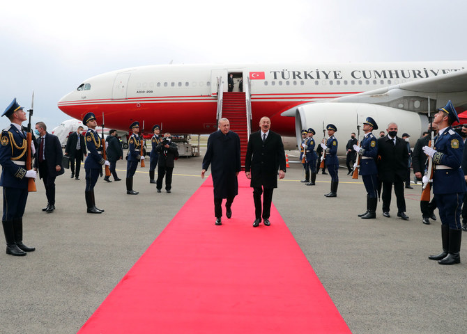 Azerbaijan's President Ilham Aliyev and Turkey's President Tayyip Erdogan attend the inauguration of the new Fuzuli International Airport in Fuzuli, an area Azerbaijan recently liberated from Armenian occupation. (Handout via AFP) 