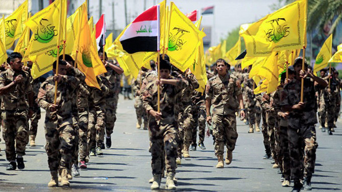 Members of Iranian-backed Iraqi militia march during a celebration in Baghdad. (AFP file photo)