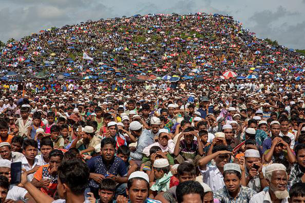 Rohingya refugees gather in an open field at Kutupalong refugee camp in Ukhia, Cox's Bazar, Bangladesh on Aug. 25, 2019. (Getty 
