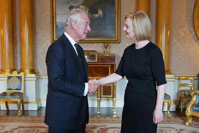 Britain's King Charles III (L) greets PM Liz Truss during their first meeting at Buckingham Palace on September 9, 2022. (AFP)