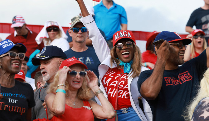 People await the arrival of former US President Trump during a rally for Sen. Marco Rubio in Miami on November 6, 2022. (AFP)
