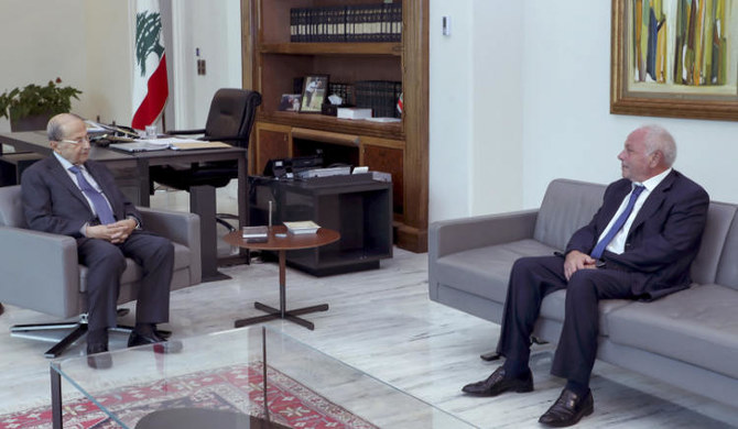 Lebanese Judge Ghassan Ouweidat (R) meeting with President Michel Aoun at the presidential palace of Baabda on July 30, 2021. 