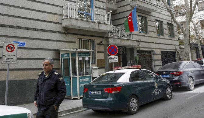 A policeman stands guard in front of the Azerbaijan embassy in Tehran on January 27, 2023, following an attack. (AFP)