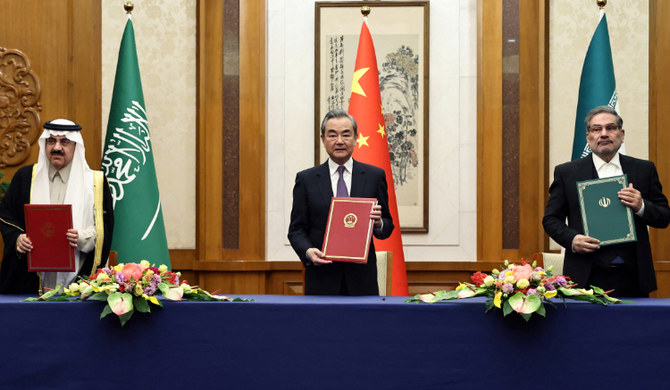 Wang Yi attends a meeting with Iran’s Ali Shamkhani and Saudi Arabia’s Musaad bin Mohammed Al Aiban in Beijing, China. (REUTERS)