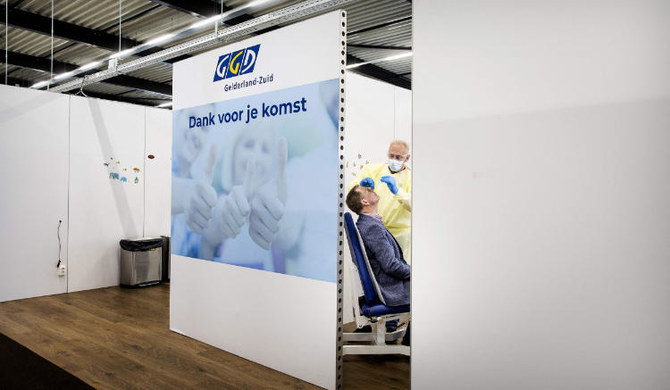The last Covid test is taken from a person in a Covid testing centre in Tiel, on March 17, 2023 before it closes. (AFP)