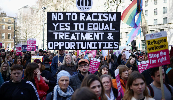 Protesters demonstrate against the government's anti-refugee bill outside Downing Street in London, March 18, 2023. (REUTERS)