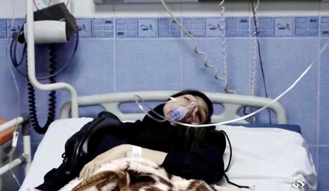 A young woman lies in hospital after reports of poisoning at an unspecified location in Iran. (REUTERS)
