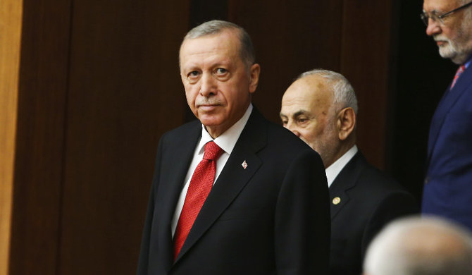 Turkish President Recep Tayyip Erdogan joins legislators elected to the Grand National Assembly of Turkey in Ankara. (AP)