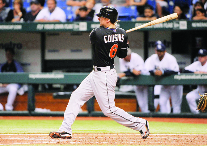 Cousins triple lifts Marlins over Rays